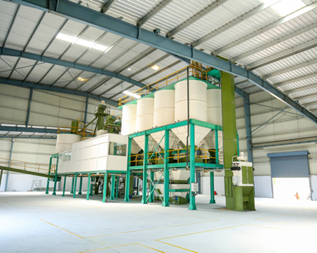 Automated feed mill silos and batching equipment supplying Kasthuri Breeding Farms